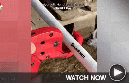 A saw removes part of a metal pipe